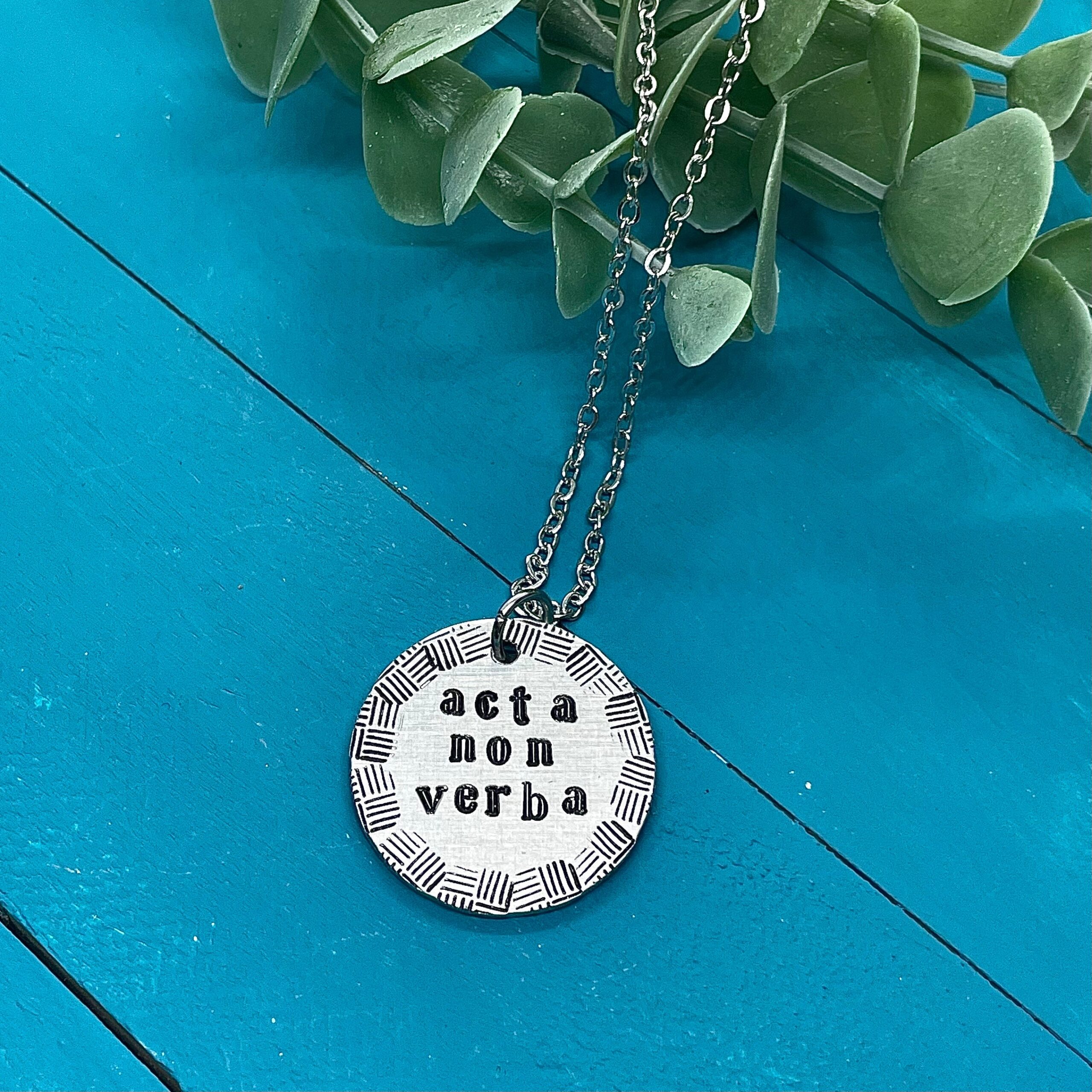 acta non verba necklace